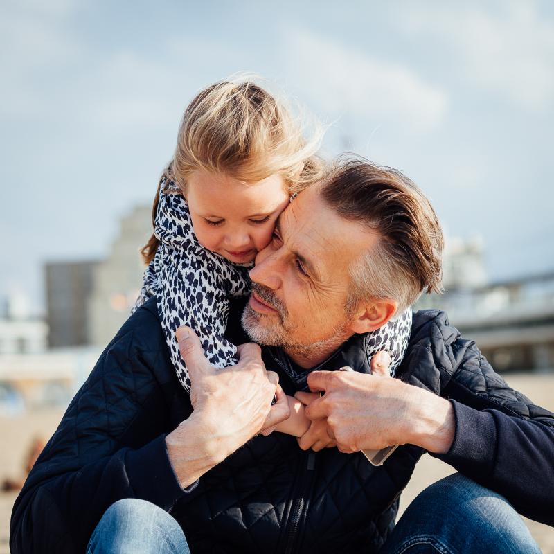 Man with child on neck