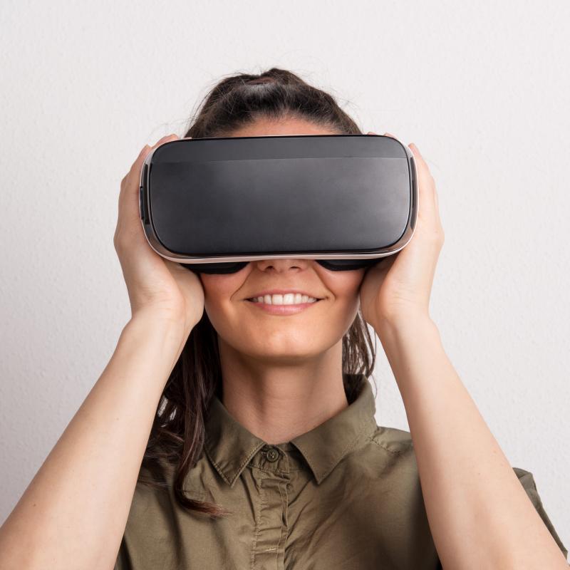 Happy woman wearing VR headset